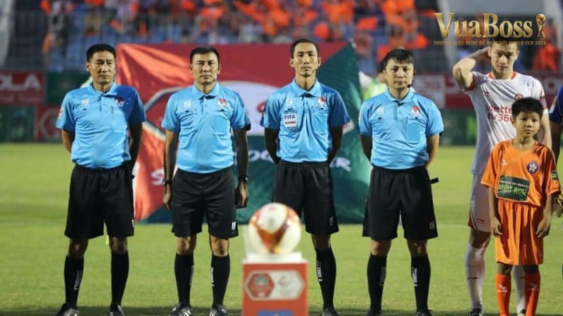 Captain tossing coin under stadium lights